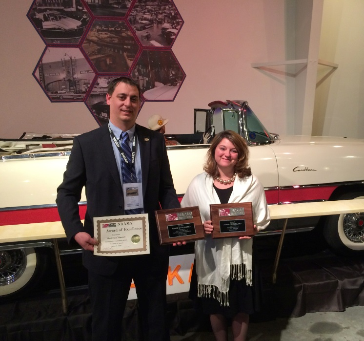 OHTM Auction and Event Coordinator Toby Stinson (left) and OHTM Volunteer Coordinator Niki Janczura show off three NAAM awards presented to the Museum at the National Association of Automobile Museums annual conference at the National Packard Museum in Warren, OH.