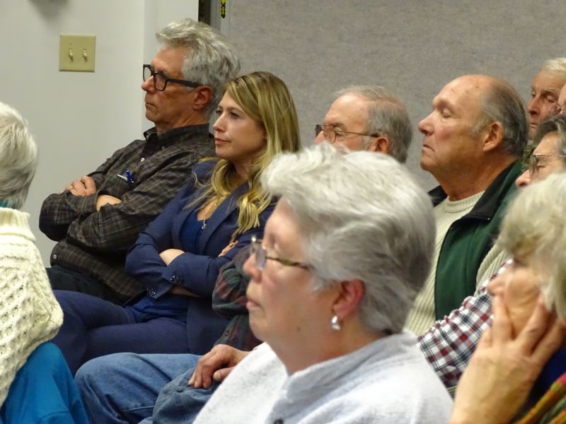 District 11 Senator Elect Erin Herbig listens amongst the crowd during the meeting. (photo by Erica Thoms)