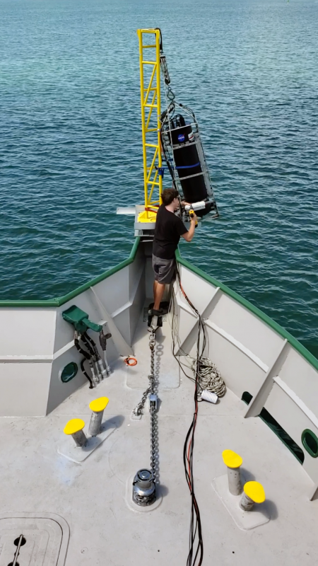 Brian Collister, a doctoral student at Old Dominion University, tends to a laser-based lidar system during a research cruise in the Bahamas. Collister is part of a team of researchers that has established a new approach to detect algae and measure key ocean properties using this tool. Courtesy of Richard Zimmerman/Old Dominion University