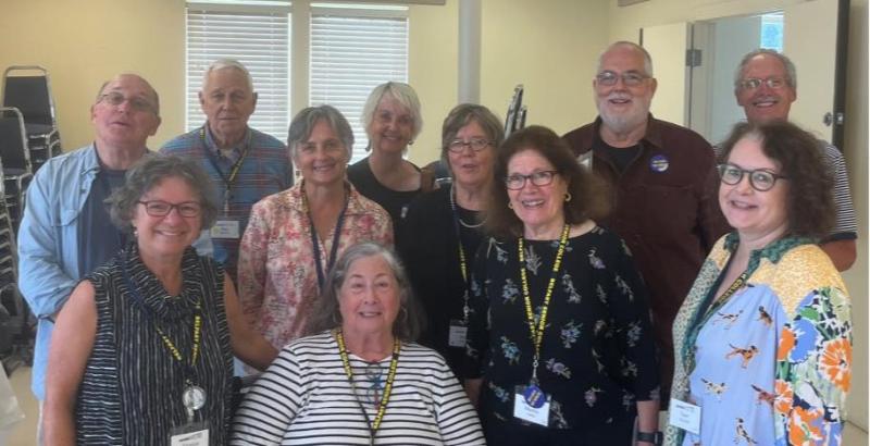 Incoming and Outgoing Belfast Senior College Board of Directors members at the 2023 BSC Annual Meeting. Top row, left to right: Mike Ray, Ron Jarvella, Marjorie Arnett, Doug Chamberlin, Jim Owen. Bottom row, left to right: Monica Morris, Denise Pendleton, Mayo Bulloch, Martha Laitin, Samantha Causon, seated at center, outgoing president Nancy Perkins. (Photo courtesy Belfast Senior College)