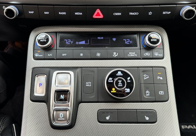 The center console looks deceptively simple, but—with the large touchscreen just above—it provides a myriad of safety, comfort and convenience features. The e-brake button is exactly where it belongs, but it’s almost unnecessary as the parking brake engages and disengages automatically.