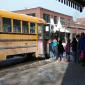 Elementary school students arrive at a Strand educational event