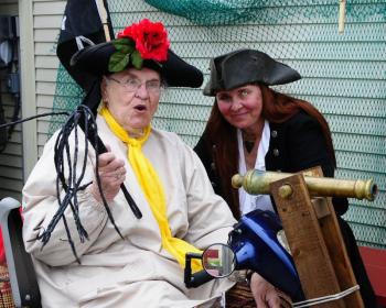 Barbara Tomlinson with Mother: Pirating was a family affair for Barbara Tomlinson (right) in her role as Bloodthirsty Barbara with her mother Dorothy Mardiat (left) in her role as Naughty Dottie. Tomlinson passed away on Jan. 22, 2014. Courtesy of Don Dunbar/eastermaineimages.com