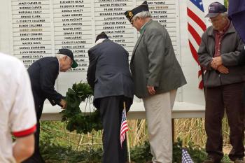 World War II veterans Alan Thomas (U.S. Navy) and Dale Hyssong (U.S. Army) lay a wreath on the Lincolnville Honor Roll during the town’s Memorial Day observance on May 30. With Thomas and Hyssong is American Legion Post District 6 Commander Ray Lewis. (Photos by Holly S. Edwards)