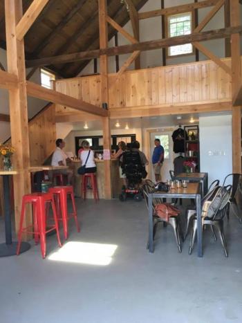 Inside the converted century-old barn that has been converted to serve as the tasting room at Lake St. George Brewing. (Photo: Jenna Lookner)