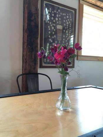 A lovely table appointed with local flowers inside the Lake St. George tasting room which, along with the brewery, is situated in a beautifully renovated barn hailing from more than a century ago.