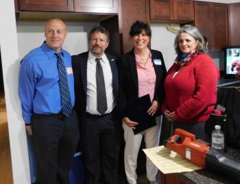 Left to right: Jon Ingraham of MaineStream Finance, Chris Linder of MaineStream Finance, Meg Klingelhofer of HFHWC, and Kelly Cotiaux a representative for Senator Susan Collins. (photo by Erica Thoms)