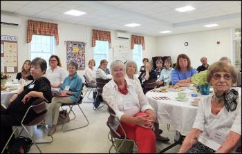 Members of the Camden Garden Club listen to the History of Tea