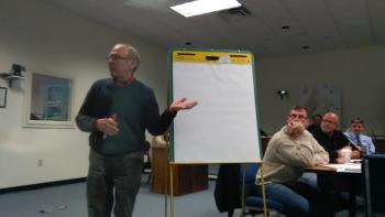John Alexander, Chair of the Rockport Planning Board, gathered questions as a neutral third party.