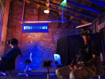 Participants sit under a monofilament installation by Rachel Lee Zheng with VR (virtual reality) headsets and earphones to interpret filmmaker stories. (Photos by Kay Stephens)