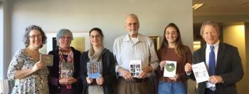 Belfast Flying Shoes board members present contra dance DVDs to Belfast Free Library staff (L to R: Chrissy Fowler, BFS secretary; Christina Barstow, BFS associate treasurer; Erica Rubin-Irish, youth services librarian; Lee Stover, BFS president; Sharon Pietryka, reference and special collections librarian, and Steve Norman, library director.)