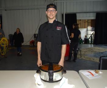Jake Grass represented Delvinos in the competition and said their chili has “more of a Caribbean flair,” with jerk seasoning and pork. (photo by Erica Thoms)