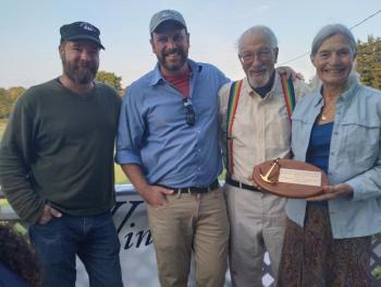 New and former captains of the Schooner Heritage pose. From L to R: Ben Welzenbach, Sean Grimes, Doug Lee, Linda Lee. (Photo credit Maine Windjammer Association)