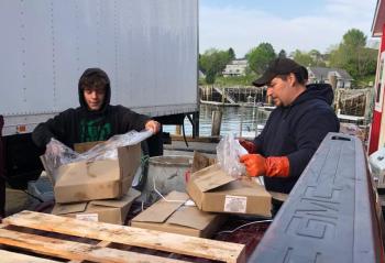 Lobstermen Damien Weaver and Ralph Jones were at work at the harbor, while the Good Morning America production crew was setting up nearby.