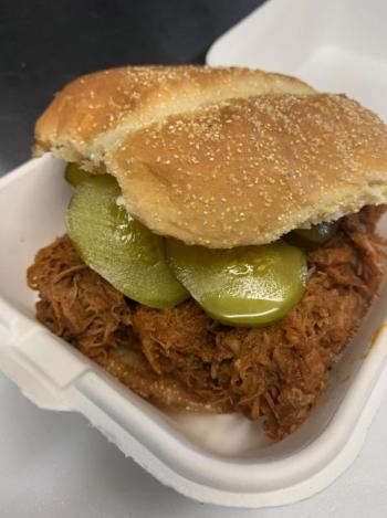 Slow-roasted pulled BBQ Pork with dill pickles and housemade bbq sauce. Photo courtesy Tai Leavitt