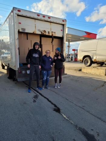 Over 170 boxes were loaded into two panel trucks to be transported back to Belfast for delivery to area citizens. (Photo by John Lynam)