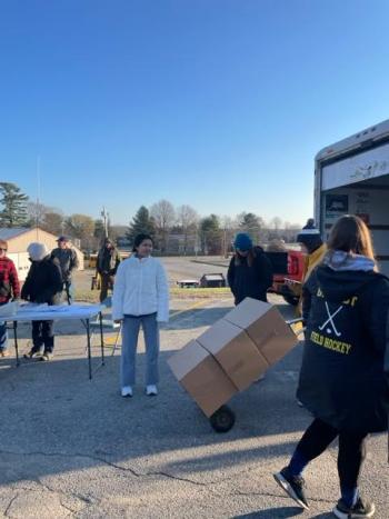 At the BAHS parking lot, Lions and LEOs and VFW members loaded several pick-ups and vehicles for distribution of the Thanksgiving basket around town. (Photo by Pam Lynam)