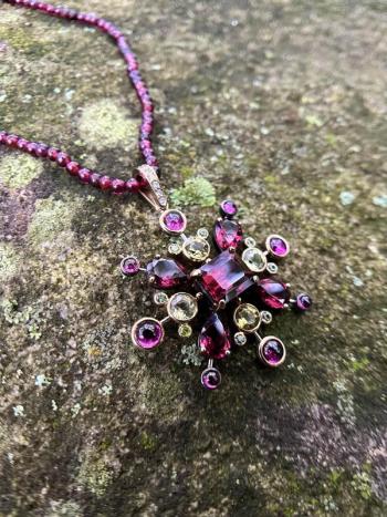 Garnet Burst Necklace harvests the light. Photo courtesy Seth Fainkujen