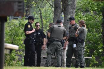 Some of the responding Knox County Sheriff’s deputies correspond with Maine Wardens at the scene. (Photo by Sarah Thompson)