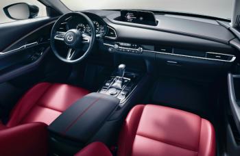 This is the available 10.25-inch touchscreen, one of the few changes from 2023 to ’24 in the CX-30, with wireless Apple CarPlay and Android Auto; it works with the turn & click knob on the center console. (Standard is an 8.8-inch screen; both interface with the MyMazda app.) Commonly used functions are controlled by actual switches, not sliders, and some are duplicated on the steering wheel. In Premium Plus trim, the CX-30 cabin approaches Audi/BMW levels of fit, finish and design.
