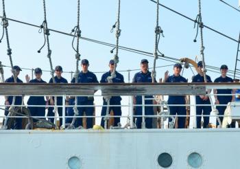 U.S. Coast Guard Barque Eagle cadets line to decks Aug. 2 to welcome visitors aboard the ship. (Photo by Lynda Clancy)
