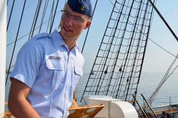 Lieutenant Junior Grade Zachary Beaudoin, of Scarborough, Maine, has been on the Eagle since 2022 as a deck watch officer. He and the several other watch officers are responsible for the safe operation of the ship, and a direct representative of Captain Jessica Rozzi-Ochs when she is not present. He came into the Coast Guard from officer candidate school, and prior to that, he was with the U.S. Marine Corps. “I really love the Coast Guard mission. You are saving lives and helping the homeland.” His wife is also from Scarborough, and in the Coast Guard herself, stationed at the Academy. They have two sons. “I am planning to make a career of this. I love the Coast Guard and looking forward to serving more.” Preferably in New England, and maybe Maine, they hope. (Photo by Lynda Clancy)