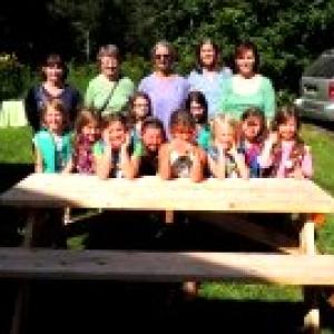 Girl Scout Troop 2002 and leaders. Front L to R: Emma, Lydia, Abby, Riley, Zoe, Lily, Ava and Kayla; Middle L to R: Emily and Maya; Rear L to R: Susan, Elaine, Victoria, Margaret and Denise. (Photo courtesy of Denise Pease)