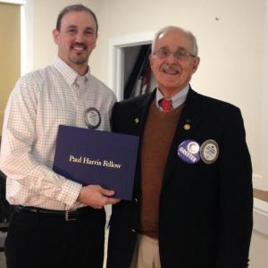 Jim Bowditch, right, of The Camden Rotary Club, awards Troy Curtis, the Chief Executive of the Penobscot Bay YMCA, his second Paul Harris Fellow Award. (Photo Courtesy of Barry Timms)