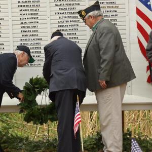 World War II veterans Alan Thomas (U.S. Navy) and Dale Hyssong (U.S. Army) lay a wreath on the Lincolnville Honor Roll during the town’s Memorial Day observance on May 30. With Thomas and Hyssong is American Legion Post District 6 Commander Ray Lewis. (Photos by Holly S. Edwards)
