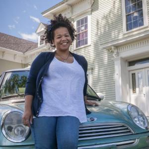 Destiny with her new car, donated by an angel in the community, in front of the shelter where she lived up until a few months ago.