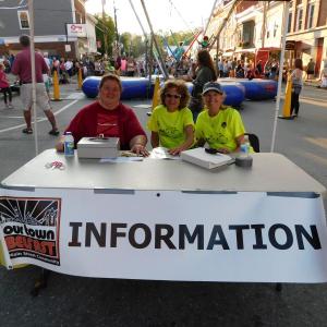 Left to right: Linda Earls, Linda Garson Smith, and Debbie Murphy man the High Street information table.