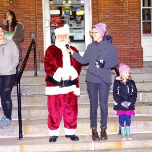 Santa and Belfast Mayor Samantha Paradis speak to the crowd just before the tree is lit. (photo by Erica Thoms)
