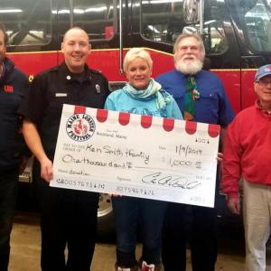 From left to right the people in the photo are: Vice President Peter Beal, Fireman Carl Anderson, President Celia Knight, Executive Board member Brian Messing, Executive Board member Jim Brickel.(Photo courtesy of the Maine Lobster Festival)