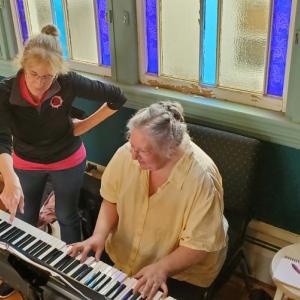 Kim Murphy (left) consults with accompanist joani mitchell at a rehearsal of Belfast Maskers' "Little Shop of Horrors." (Photo courtesy Belfast Maskers)