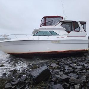 This boat washed up on an Owls Head beach during the Dec. 15 storm, the third or fourth boat in three years to break free of a mooring and get stranded on this particular beach. Boats, many fiberglass, get pummeled by harsh conditions, and if not salvaged quickly, they leave remnants on the beach and in the water. (Photo by William Garver)