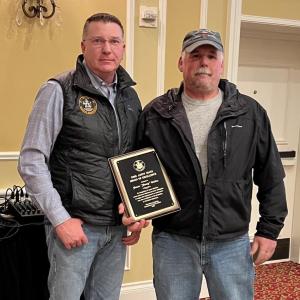 Department of Marine Resources Commissioner Patrick Keliher (left) presents the annual DMR Andy Mays Award of Excellence to Friendship fisherman James "Jimmy" Wotton of Friendship. The award was presented Saturday at the Fishermen's Forum in Rockport. (Photo courtesy Department of Marine Resources)