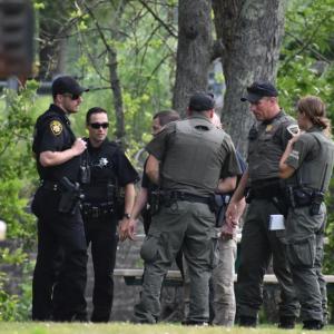 Some of the responding Knox County Sheriff’s deputies correspond with Maine Wardens at the scene. (Photo by Sarah Thompson)