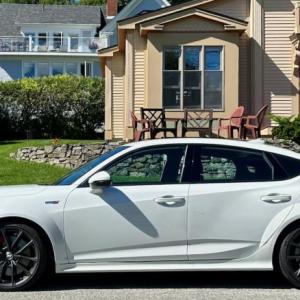 With its flared fenders and Michelin Pilot Sport 4S tires, the Type S looks lower, wider and more driving-focused than your everyday Acura Integra. The 19-inch cast-aluminum wheels also carry premium Brembo brakes. This color is Pearl White.