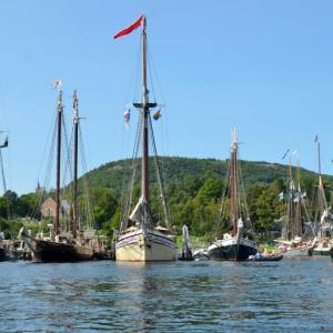 Almost all in, and lined up, in Camden, where the mountains meet the sea. It is the 2023 Windjammer Festival and the guests of honor – the fleet of schooners – is in and ready for a celebration. (Photo by Lynda Clancy)