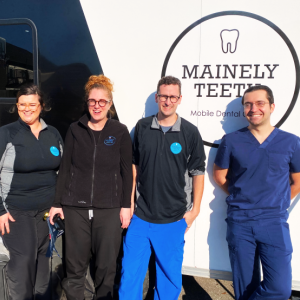 Left to right: Danielle Marshall, Dental Assistant at Mainely Teeth; Amber Lombardi -founder and president of Mainely Teeth; Michael Lombardi - co-founder of Mainely Teeth; and Dr. Robert Grassi, dentist at Knox County Dental Clinic. (Photo courtesy Knox County Homeless Coalition)