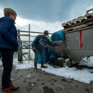 Port Clyde Fisherman’s Co-Op Manager Gerry Cushman, right, recalls how high the water was during the January storms. Port Clyde and Tenants Harbor were among the areas most damaged during the winter storms earlier this month.