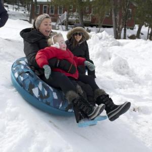 Pine Tree Camp Counsellors Kiara Warren, from Waterville, and Tina Hall, from Freedom, show Gracie Harper, from Sangerville, how to slide. (Photo courtesy of Pine Tree Camp)