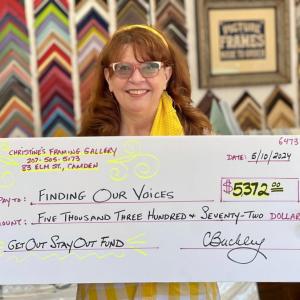 Christine Buckley has raised $5,372.00 and counting for her Maine domestic abuse sister-survivors through an ongoing art sale in her framing shop in Camden. (Photo by Patrisha McLean)
