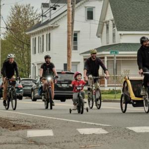 Adults and children ride toward South Elementary School, in Rockland, during May 17’s Rockland’s Bike to Work (+ School!) Day. (Photo courtesy David Troup)