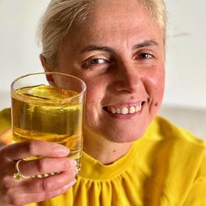 Clementina Senatore, of Paper Plane, with her Camden cocktail lounge’s July “Into the Light” drink featuring bergamot liquor and Oolong tea. Senatore, who came to Maine from Italy nine years ago “by myself, with no family or friends here,” said she stepped up to the Finding Our Voices fundraiser for domestic abuse victims because “I support courage.” (Photo by Patrisha McLean)