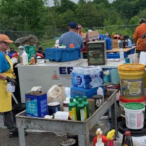 A crew from Environmental Projects, Inc., in Auburn, processes collected household hazardous waste, June 22, at the Mid-Coast Solid Waste Transfer Facility in Rockport. (Photo by Lynda Clancy)