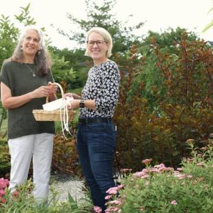 RDNA Agency Director Peta vanVuuren (l) and Councilor Penny York (r) in the Eliza Steele Memorial Garden (MacDougal Park). (Photo courtesy RDNA)