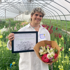 OUT Maine’s Youth Engagement Coordinator Maggie Hirshland receives the Maine Women’s Lobby 2024 Volunteer Champion Award. (Photo courtesy OUT Maine)