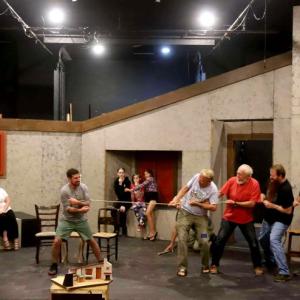 The cast of "Playboy of the Western World" (l-r: Greta Brown, Emily
LeBlanc McConnell, Tyler Johnstone, Ember Hoffman, Eden Hoffman, Isla Hughes, Mark Durbin, Tom Maycock, Tyson Hoffman, and Greg Marsanskis) rehearse on the Basil Burwell Community Theater stage. Set design: John Bielenberg. (Photo by Gwyneth Sauvage)