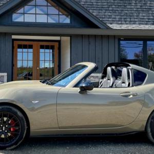 Mazda’s front-engine, rear-drive MX-5, aka the Miata, is only six feet shorter than a GMC Yukon XL, but it looks like it might fit on the SUV’s roof rack. There’s ample space and comfort for two adult humans, but pack light—the folding hard top fills the trunk. This color is Zircon Sand Metallic.